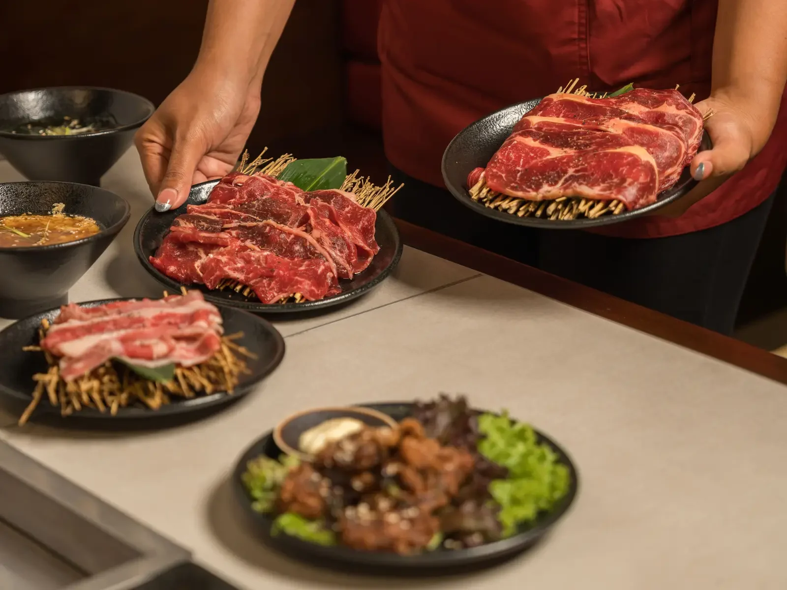 Our Experienced and friendly Staffs serving fresh cuts of meat, ready to grill at yakiniku Ubud restaurant.