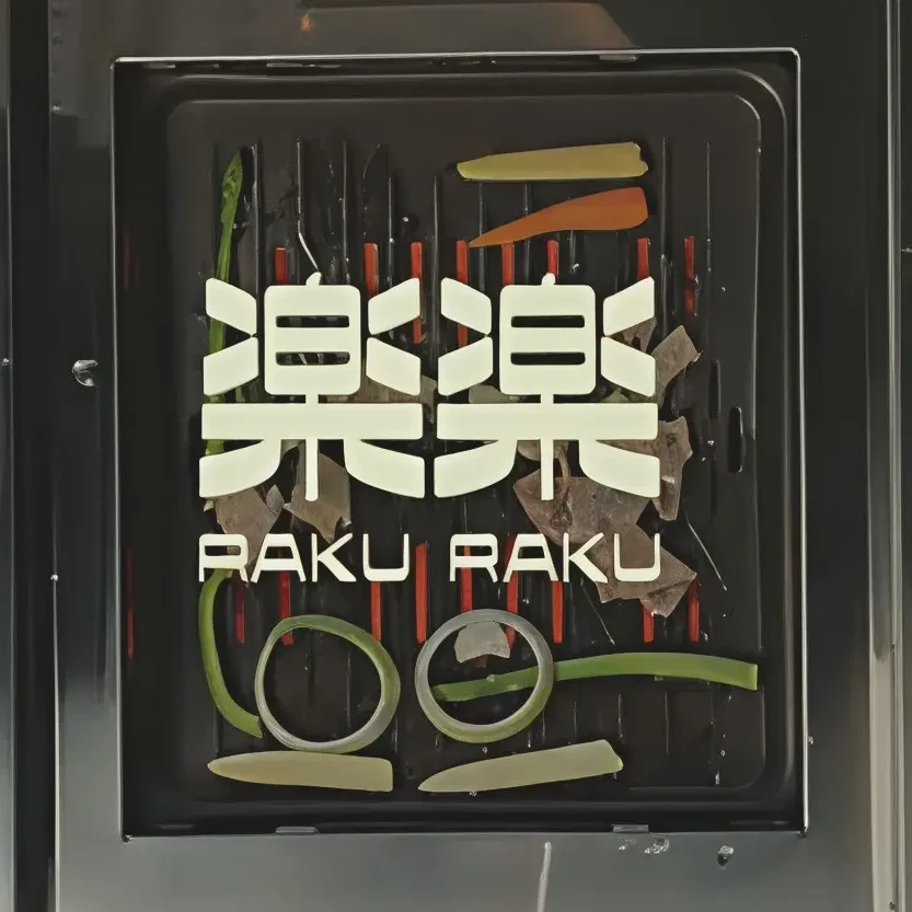 Premium wagyu beef grilling tableside at Raku Raku, the centerpiece of the comfort food menu